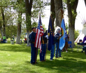Color guard featuring the US Flag, Montana Flag, Crow Tribal Flag and Chief Plenty Coups Flag, authorized by the US.
